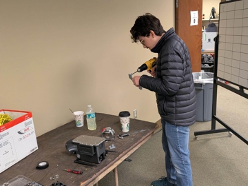 Engineer prepares the new custom adapter plate 